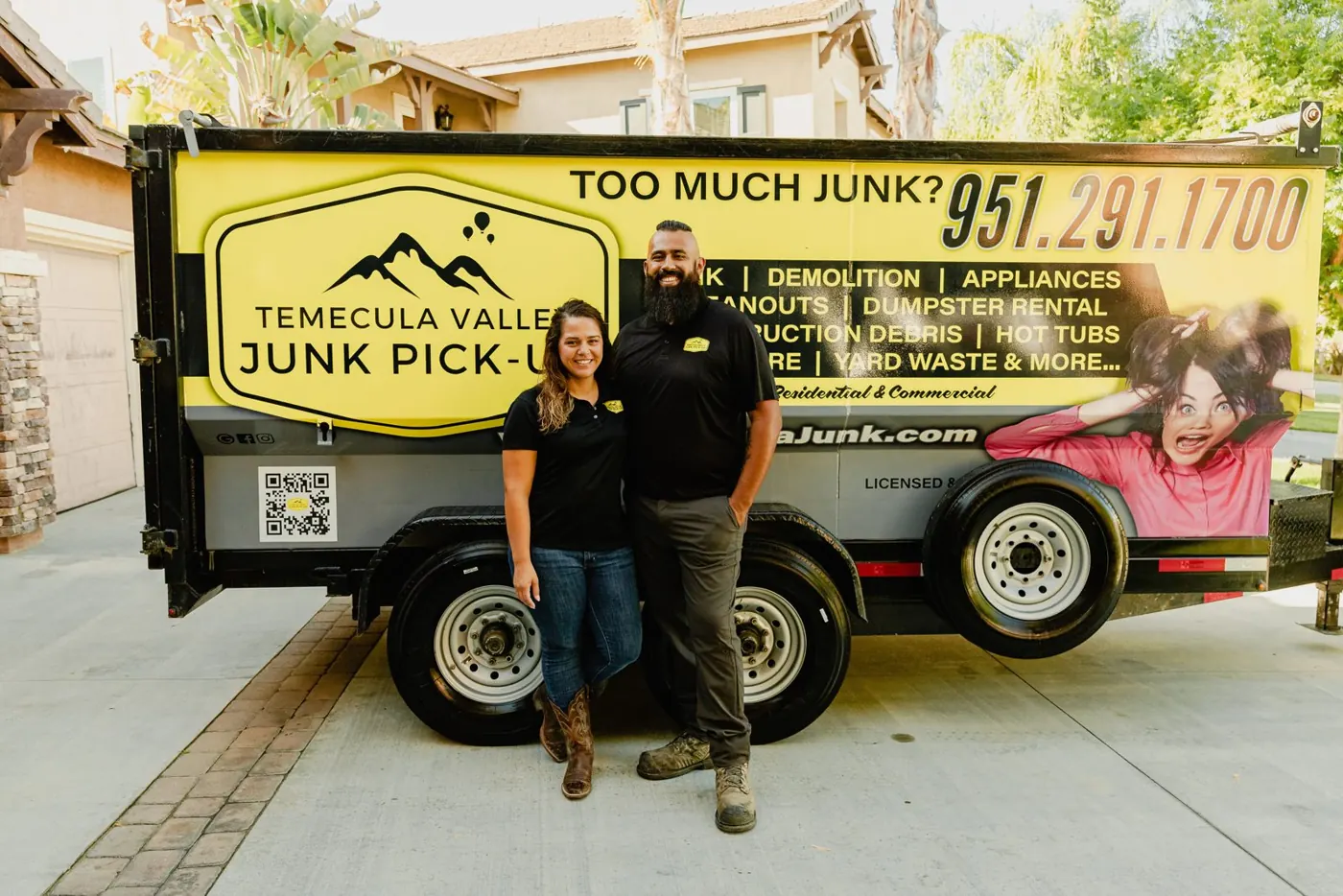 Owners in front of the Temecula Valley Junk Pick-Up trailer