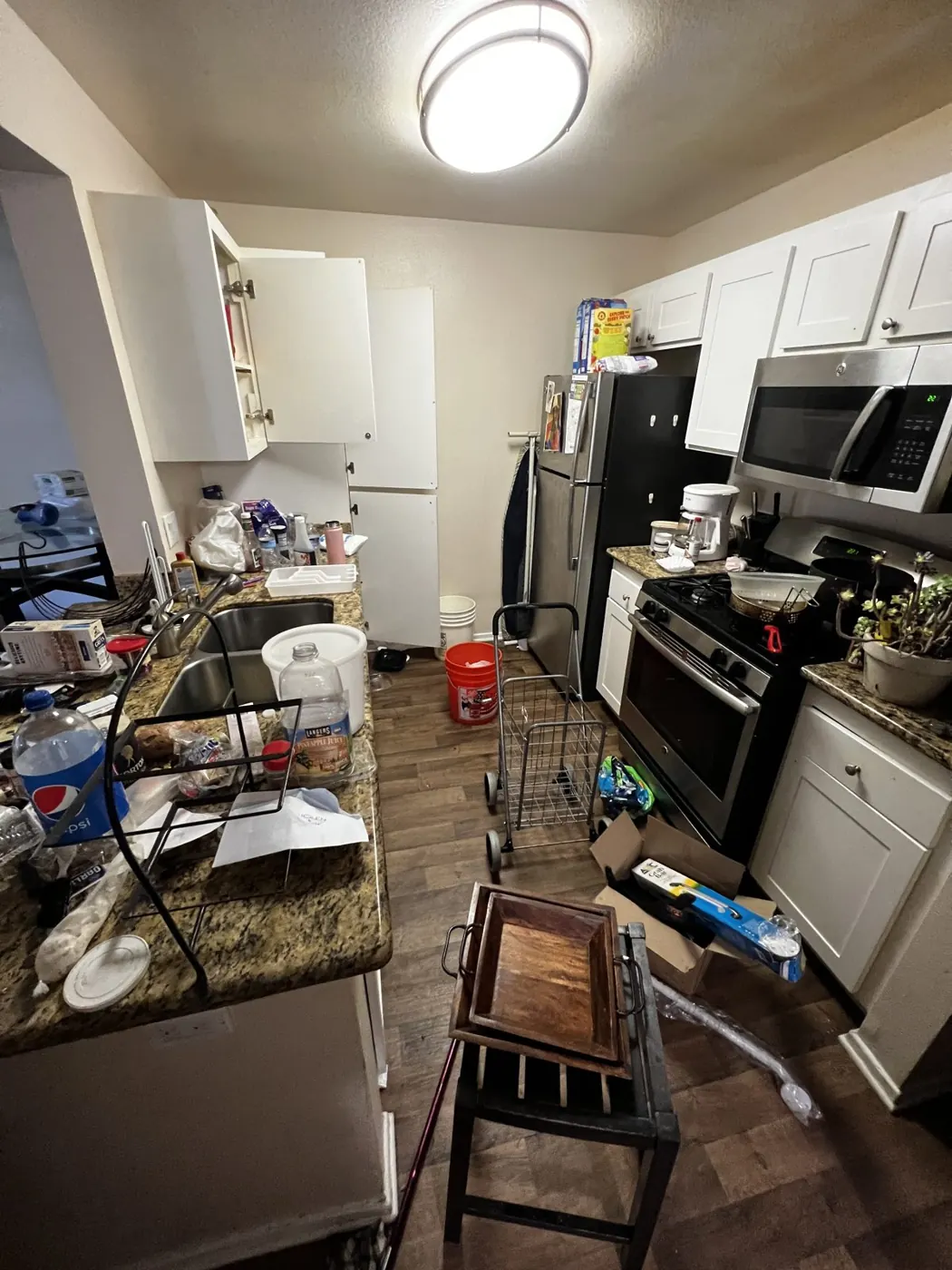 Apartment kitchen full of items left behind