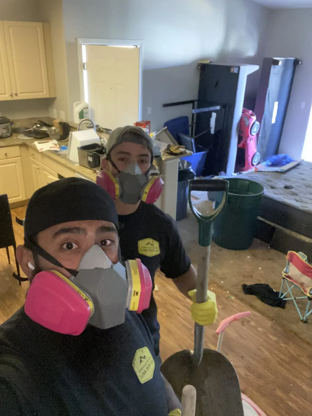 Crew wearing respirators on a cleanout