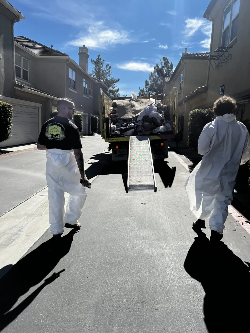 Crew in protective suits heading into a cleanout