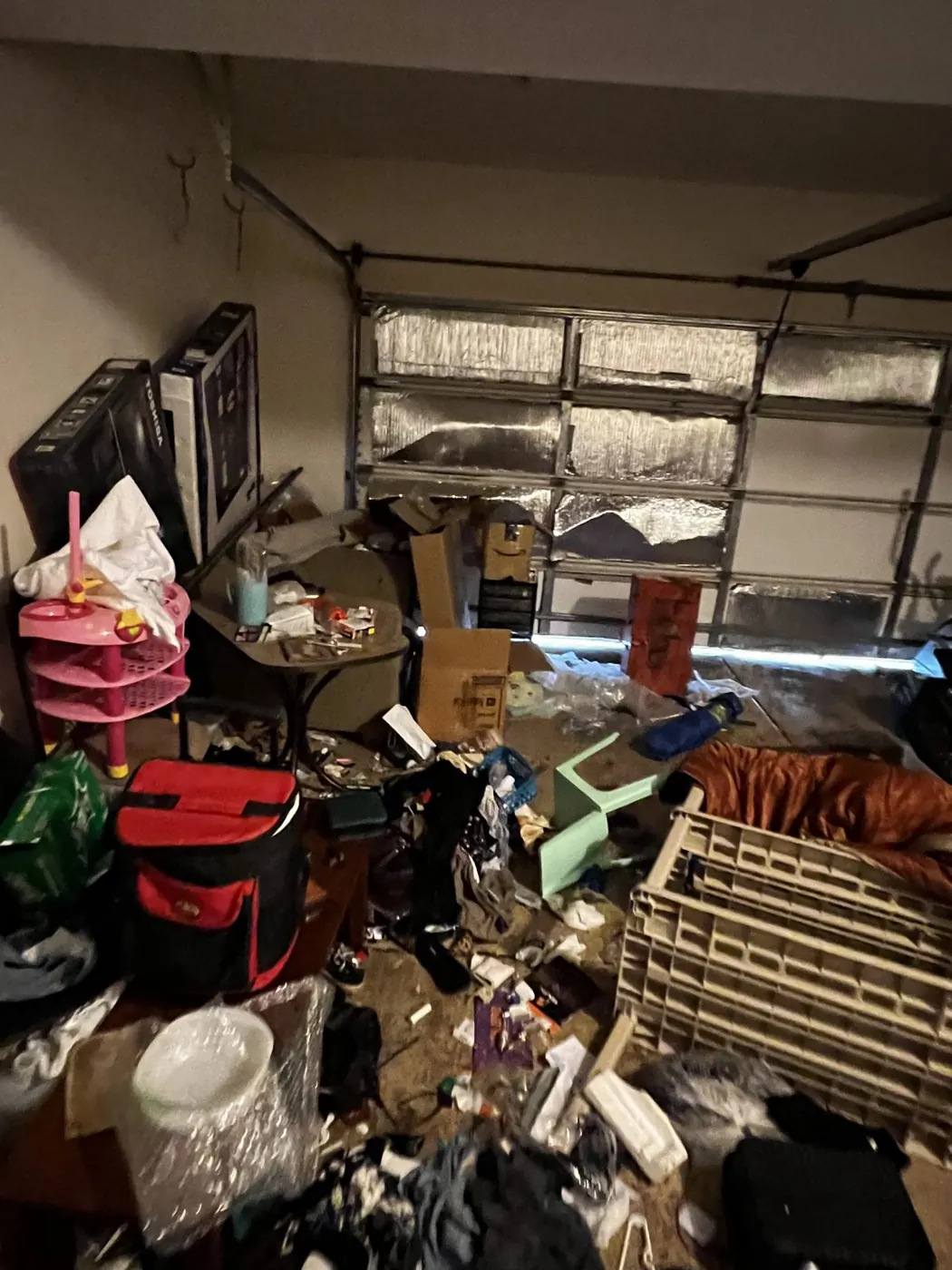 Garage full of junk before a cleanout