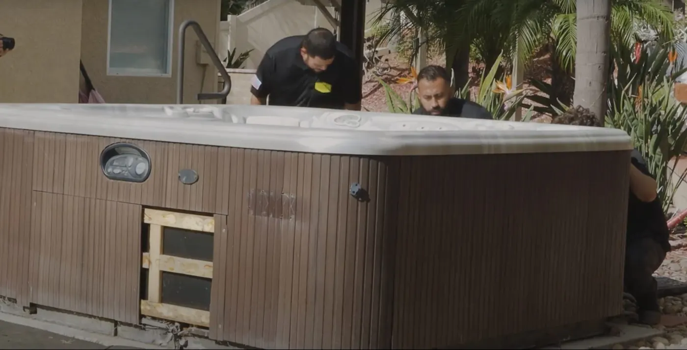 Crew removing an old hot tub