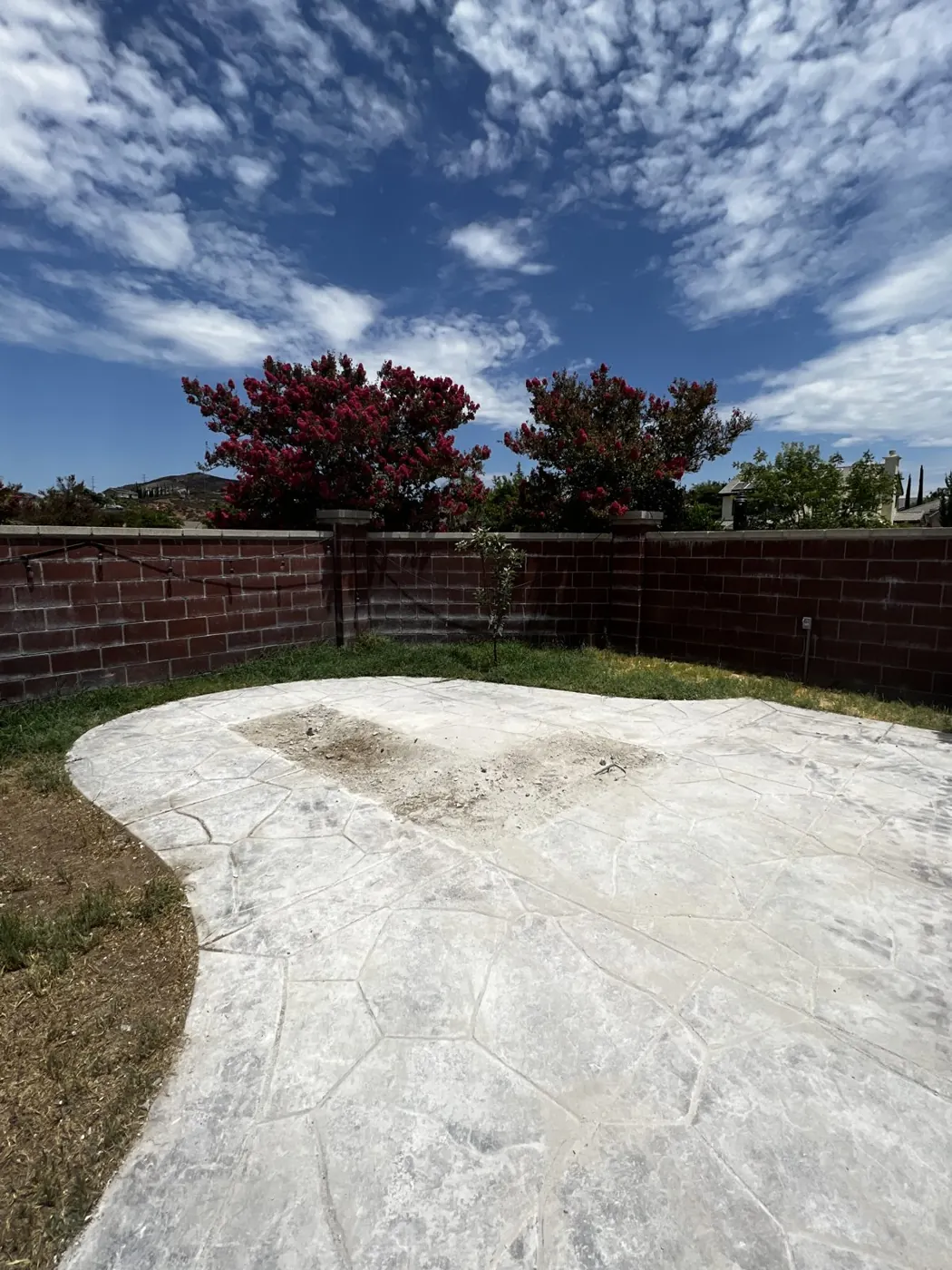 The same patio after the outdoor kitchen was torn out and hauled away