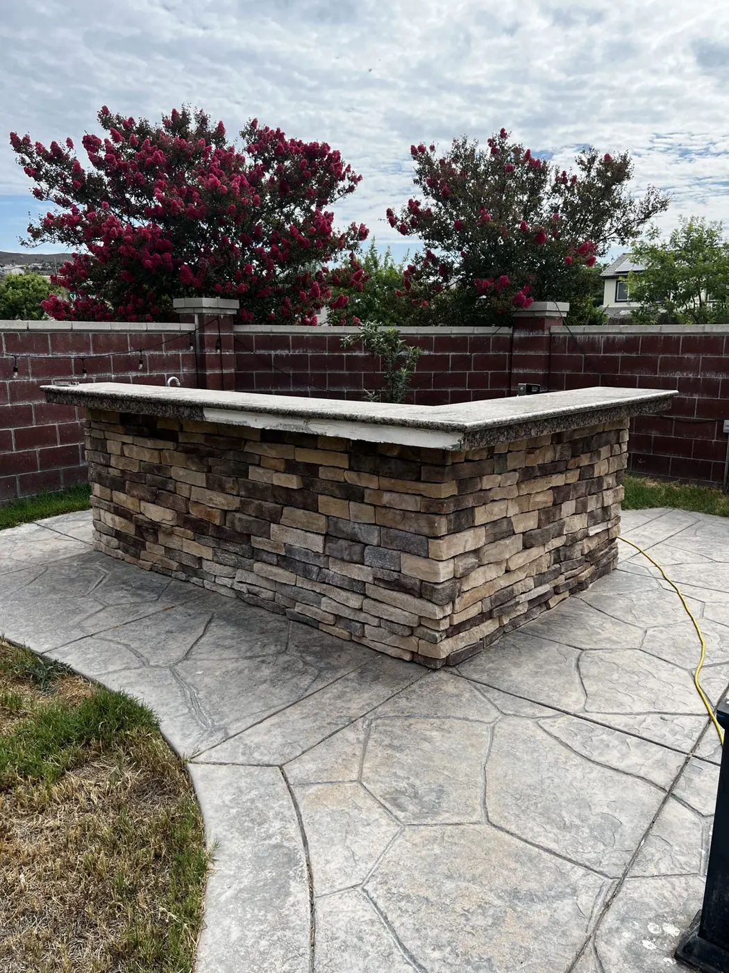Backyard outdoor kitchen before demolition