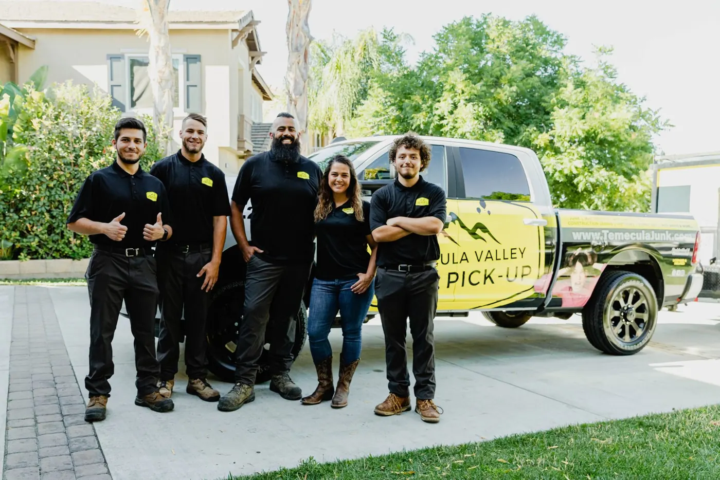 The Temecula Valley Junk Pick-Up team in front of a company truck