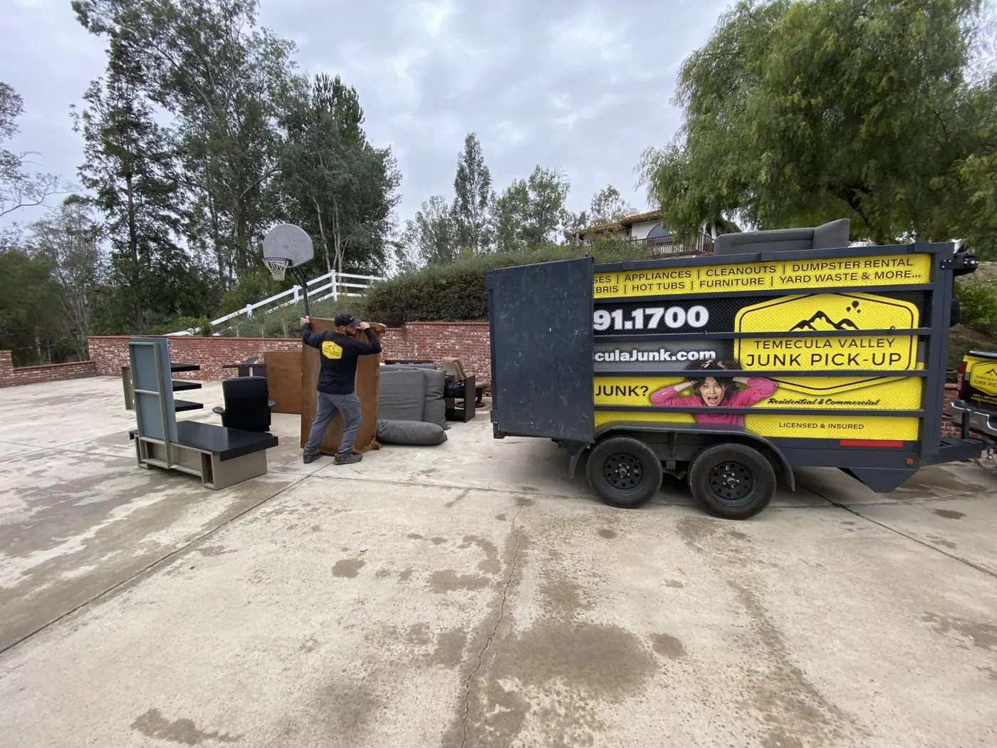 Dump trailer loaded with junk on a rural property