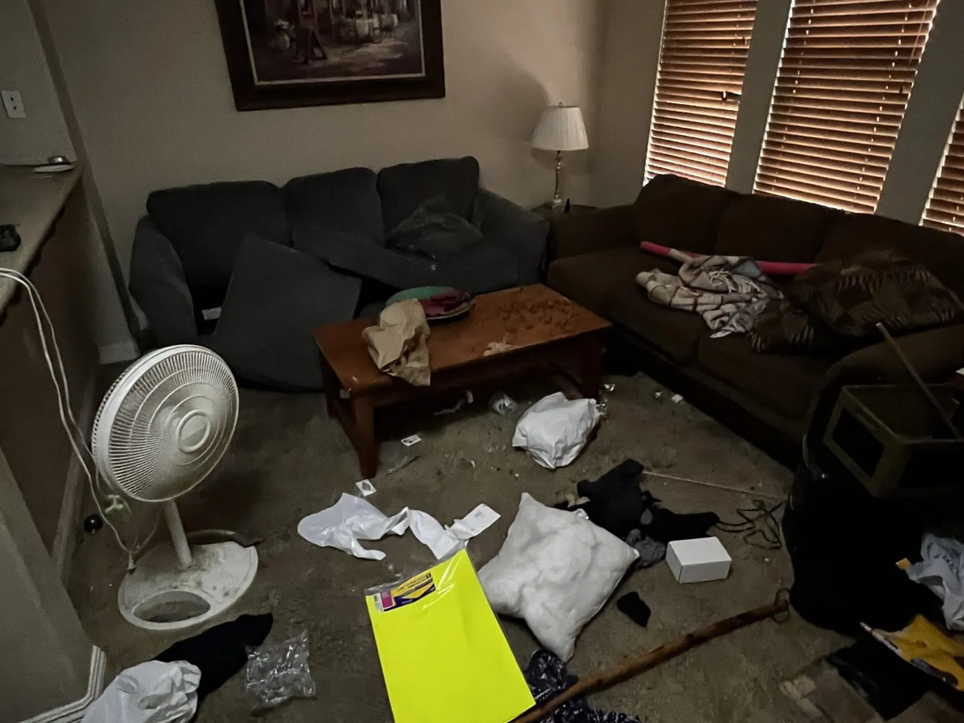 Apartment unit with furniture and trash left behind