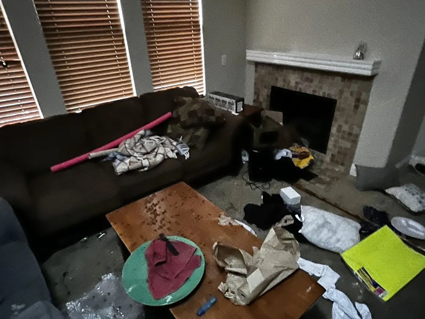 Apartment living room left trashed after a move-out