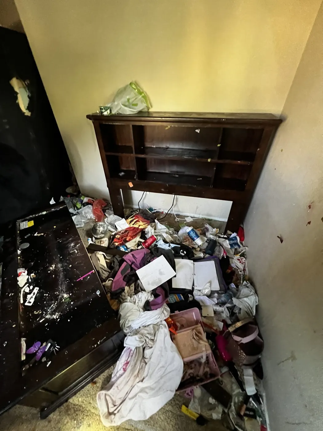 Closet filled with trash in a vacated unit