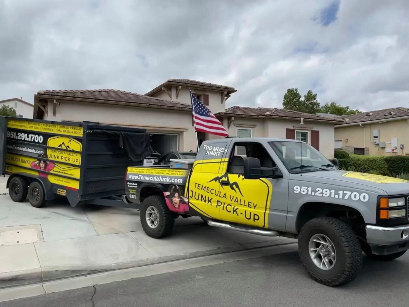 Truck and trailer parked at a home for a pickup
