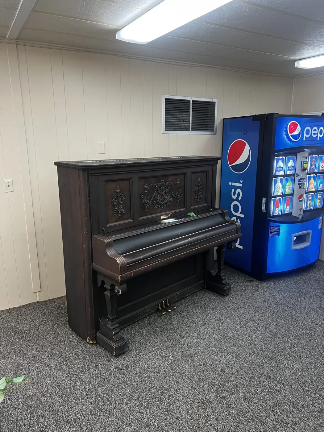 Old upright piano ready for removal